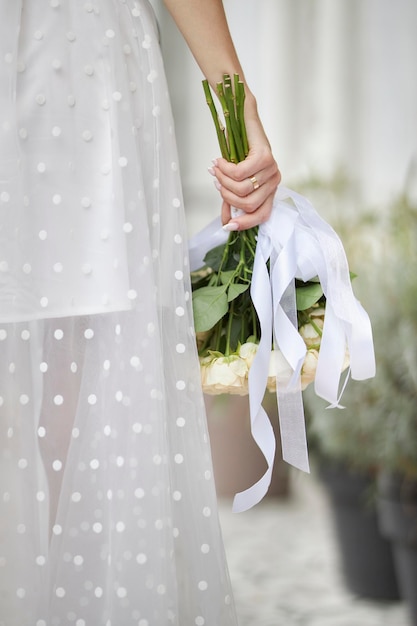 Bride with a bouquet in her hands close-up. Wedding. Delicate beautiful bouquet.