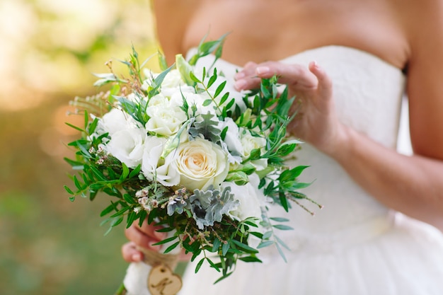 Bride with wedding bouquet.