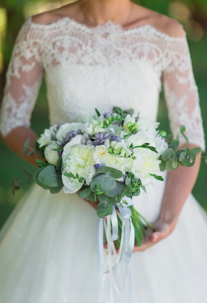 Bride with wedding bouquet.