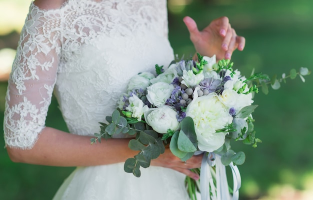 Bride with wedding bouquet.