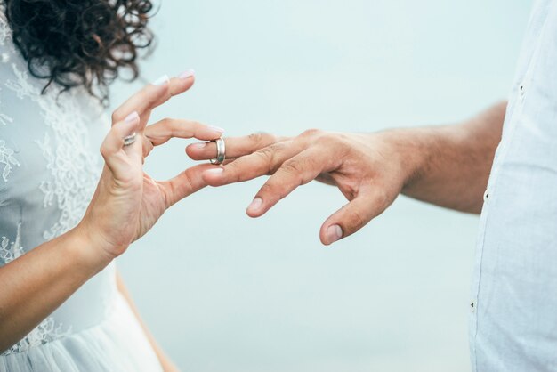 Bridegroom wearing rings on the hands