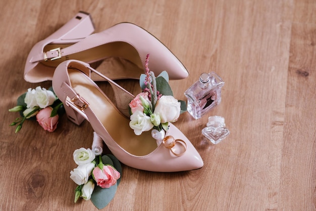 Brides accessories pretarations for wedding day, shoes and buttohole