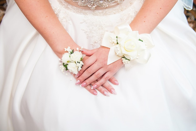 Brides hands with flowers