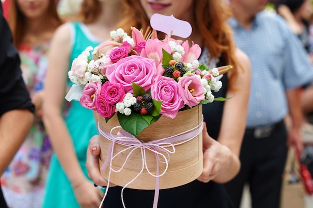 Bridesmaid holding bridal bouquet