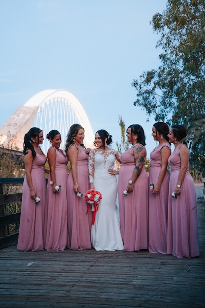 Bridesmaids looking at the bride