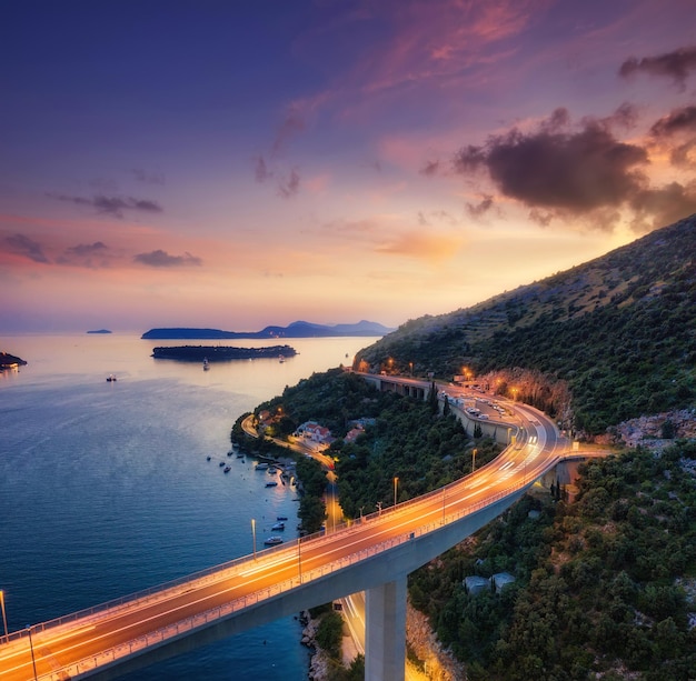 Bridge along the sea shore during sunset Aerial landscape View from drone Evening landscape