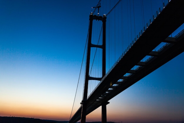 Bridge in Istanbul over the Bosphorus at sunset view from below