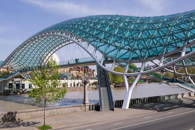 Bridge of Peace in Tbilisi across the Kura River Historic city center summer