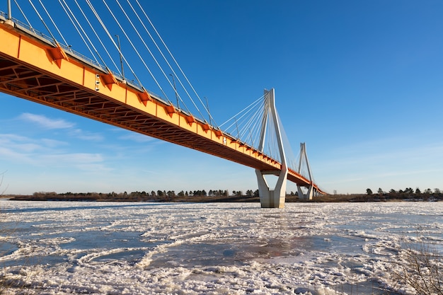 Bridge over river covered with ice