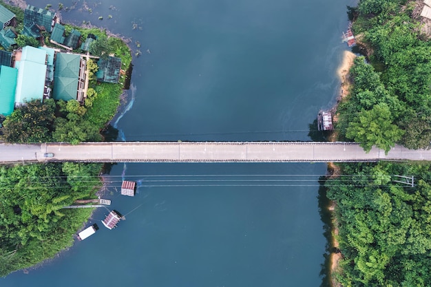 Bridge over the river among tropical rainforest in the morning at countryside