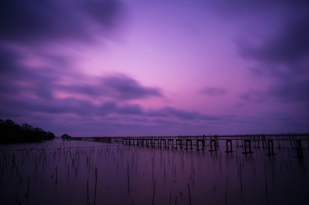 The bridge stretches out to sea and sunsets in the evening