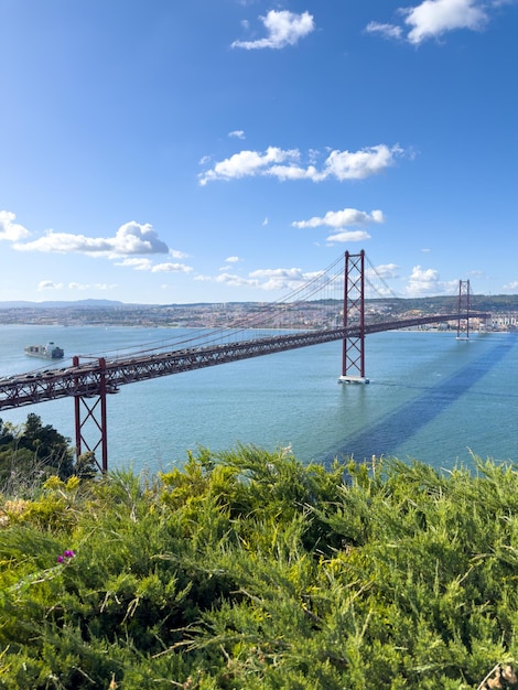 a bridge that has a boat on it and a boat in the water