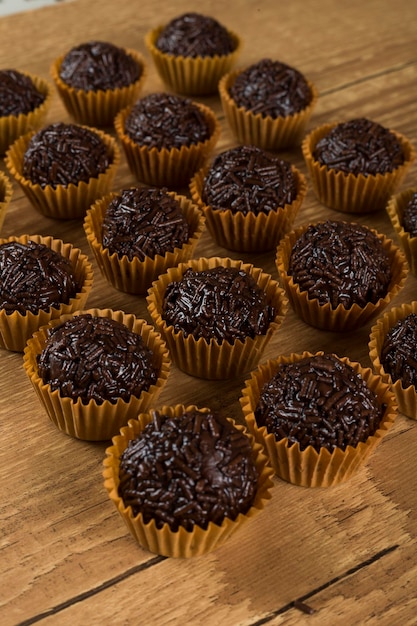 Brigadeiro a brazilian sweet made of chocolate on a wooden desk Vegan version