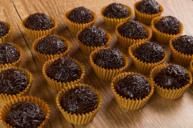 Brigadeiro a brazilian sweet made of chocolate on a wooden desk Vegan version