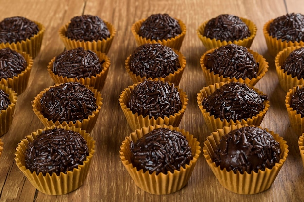 Brigadeiro a brazilian sweet made of chocolate on a wooden desk Vegan version