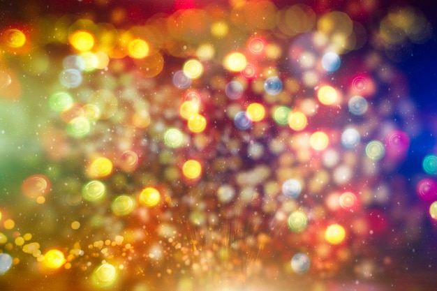 Bright abstract circular bokeh background blur on a dark background