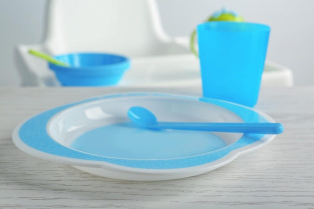 Bright baby dishware on table