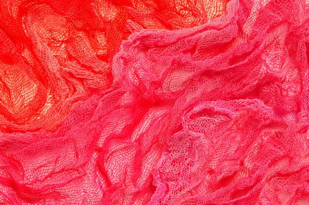 Bright background of pink and red gauze