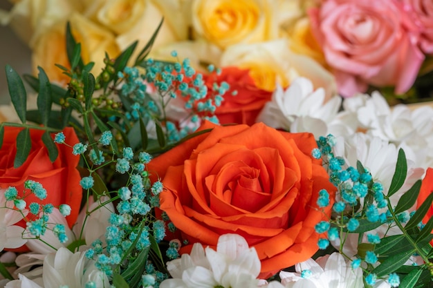 Bright beautiful bouquet red, yellow and pink of roses close up