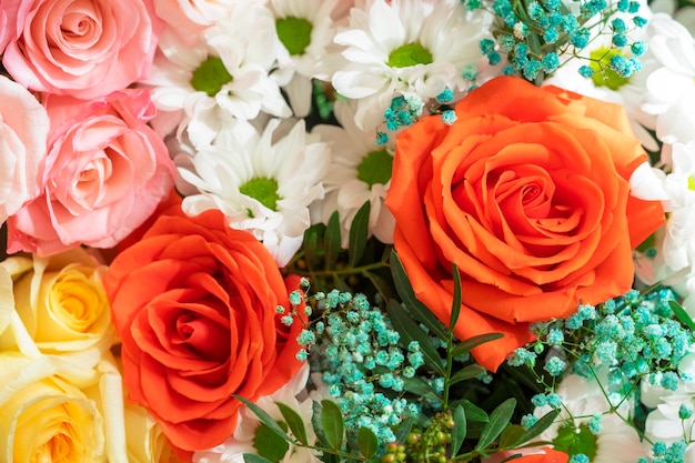 Bright beautiful bouquet red, yellow and pink of roses close up