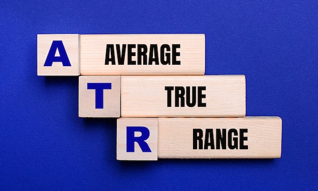 On a bright blue background light wooden blocks and cubes with the text ATR Average True Range