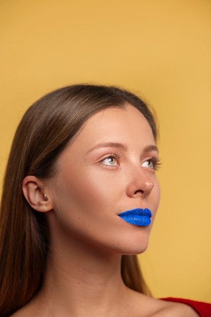 Bright blue lips portrait with copy space