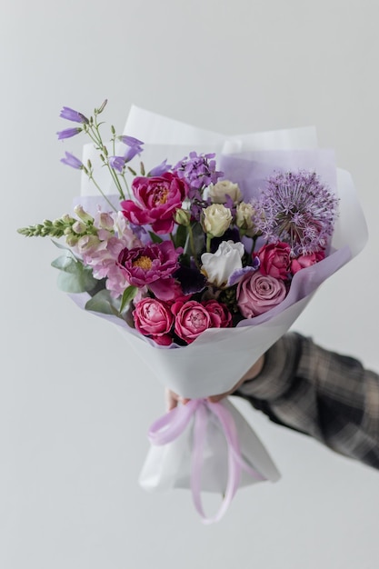 Bright bouquet of flowers in hands