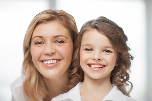 bright closeup picture of mother and daughter