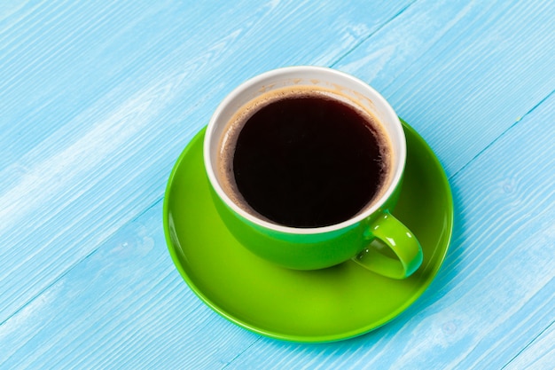 Bright colored coffee cup on a table top view