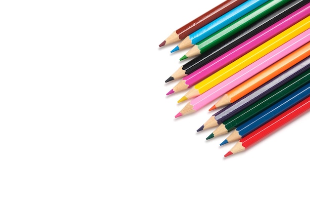 Bright colored pencils on a white background.School supplies for drawing.