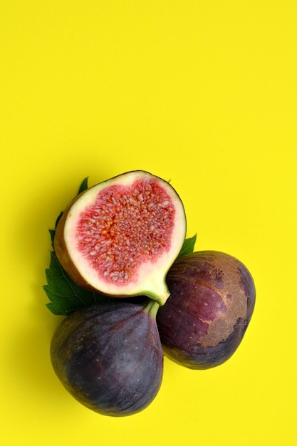 Bright colorful background ripe figs on yellow