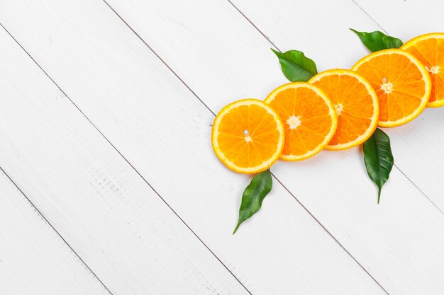 Bright composition of citrus fruits on white wooden