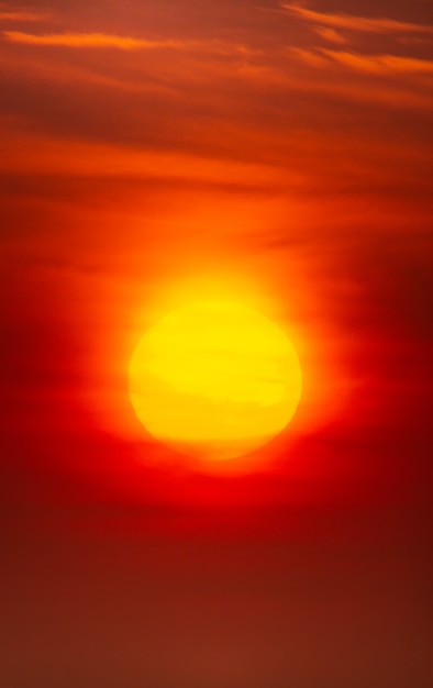 Photo bright crimson sun on a background of sunset or dawn