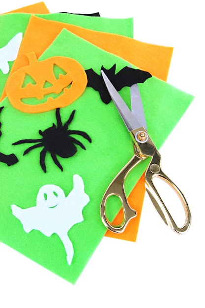 Bright felt and handmade Halloween decorations isolated on white