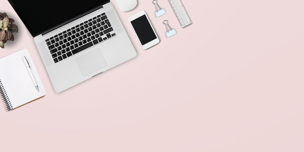 bright feminine banner , header with a stylish workspace with laptop computer, smartphone,