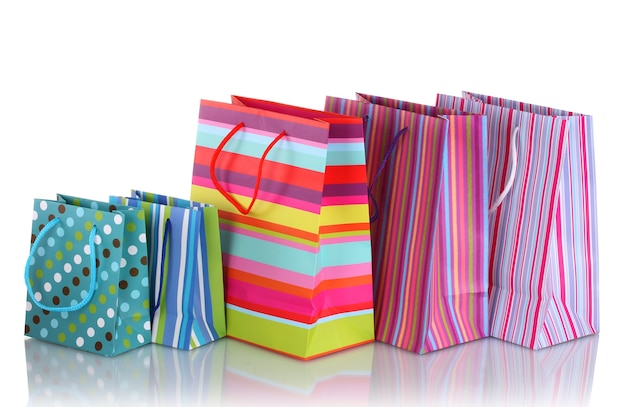 Bright gift bags isolated on white surface