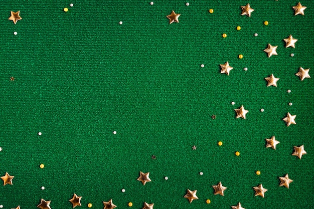 Bright green wool fabric with gold stars Christmas festive cozy textile background