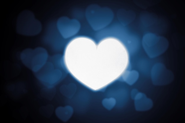 Bright heart symbol with blurred sparkling heart light