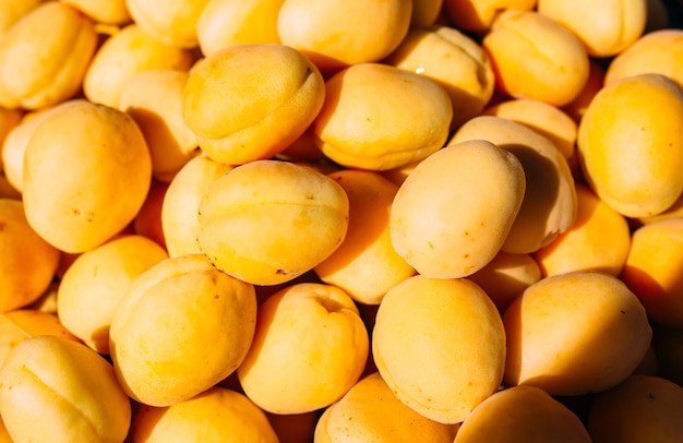 bright juicy yellow apricots on a farmers market stall