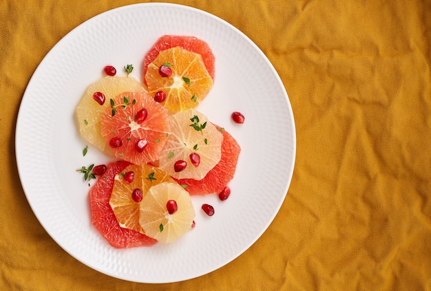 Bright mix of citrus fruits. Salad of mix sliced round slices of red and white grapefruit