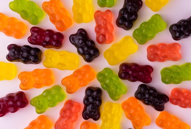 Bright multicolored gummy bears Background from jelly sweets