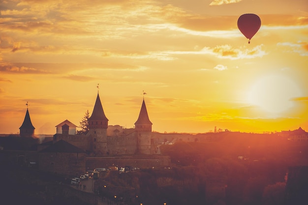 Bright orange sunset KamianetsPodilskyi castle