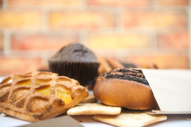 Bright pastries against brick wall backdrop pastry in outdoor cafe