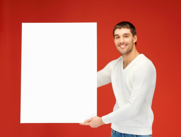 Photo bright picture of handsome man with big blank board.