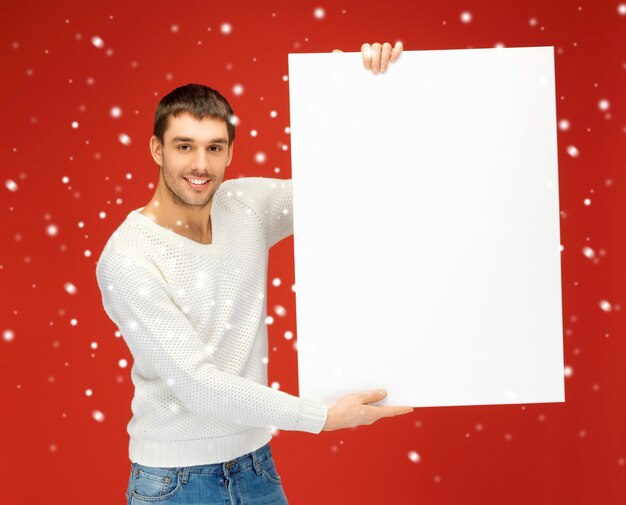 Photo bright picture of handsome man with big blank board.