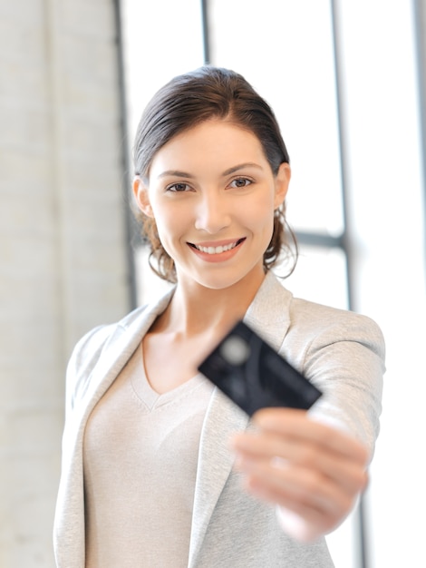 bright picture of happy woman with credit card