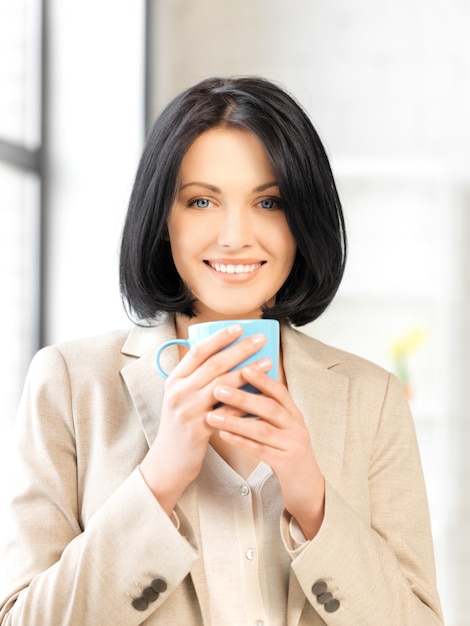 bright picture of lovely businesswoman with mug