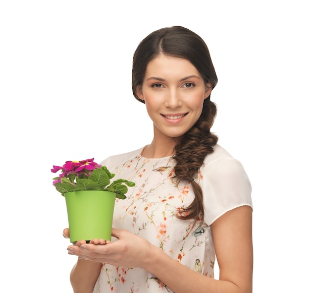 bright picture of lovely housewife with flower in pot