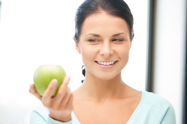 bright picture of lovely housewife with green apple