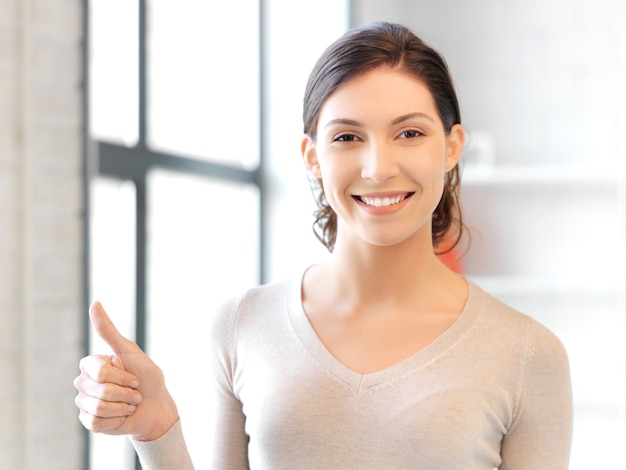 bright picture of lovely teenage girl with thumbs up